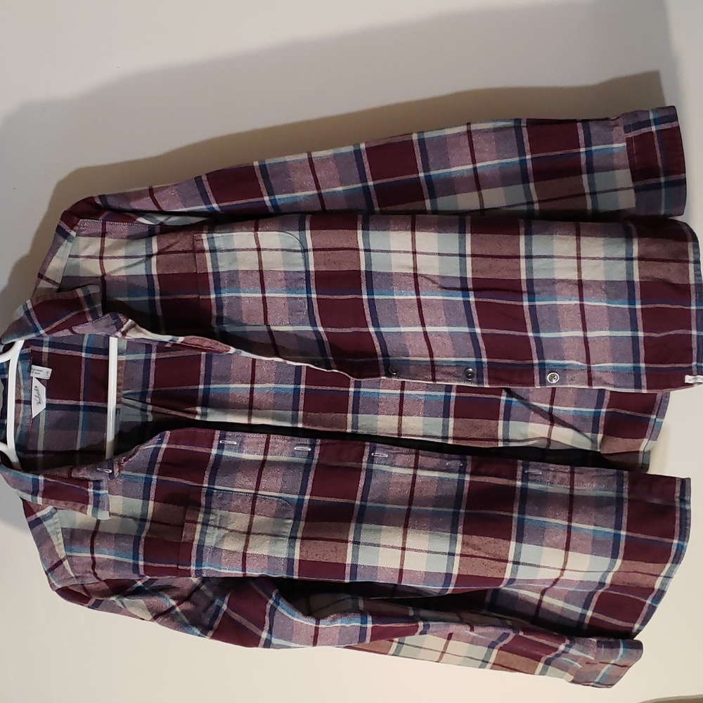 Women’s flannel. Fits more like a medium. Super cozy.